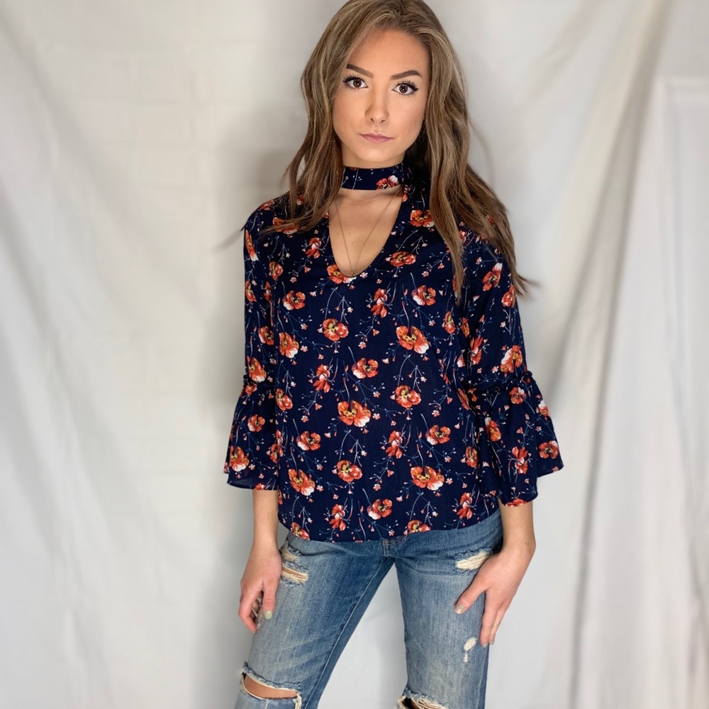 Bell-sleeve floral blouse. Size small.